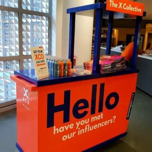 The X Collective pop up booth with antidote juice products displayed