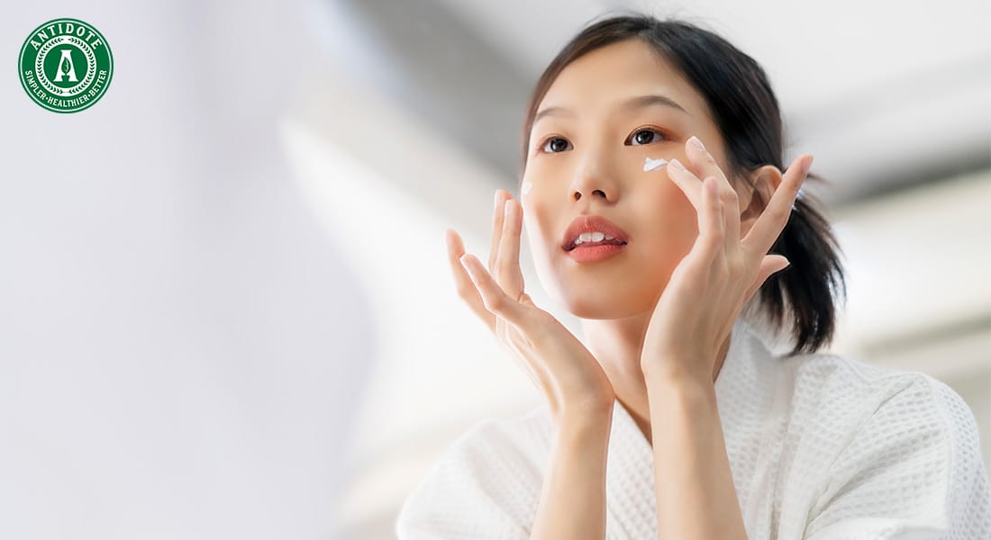 Woman applying skincare products