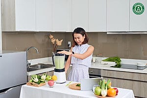 Woman drinking healthy juice for better skin.