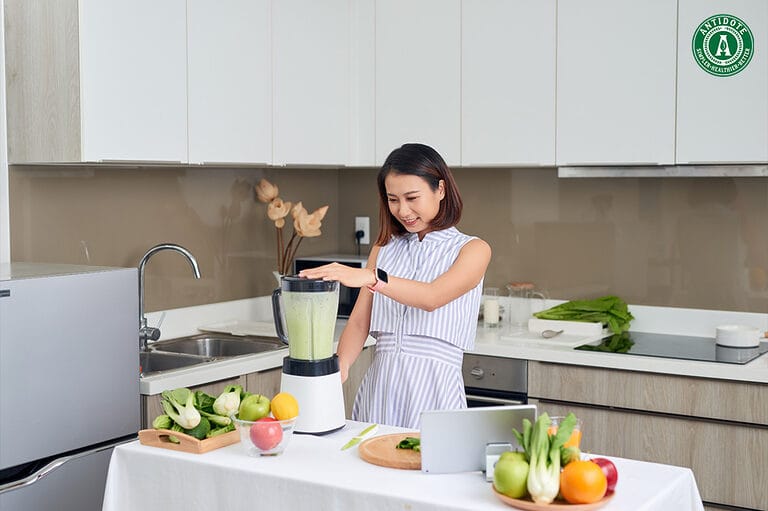 Woman drinking healthy juice for better skin.