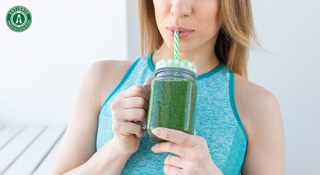 woman drinking detox fruit juice